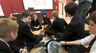 Photo of school children assembling the Moonsaic